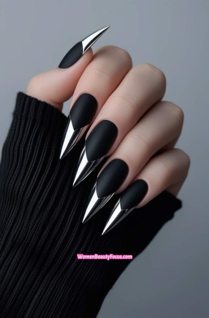 3. Black Stiletto Nails with Chrome Tips