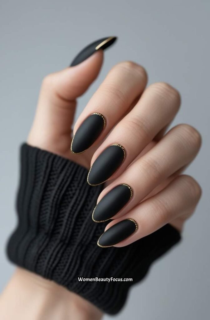 3. Elegant Black Matte Nails with Gold Detailing