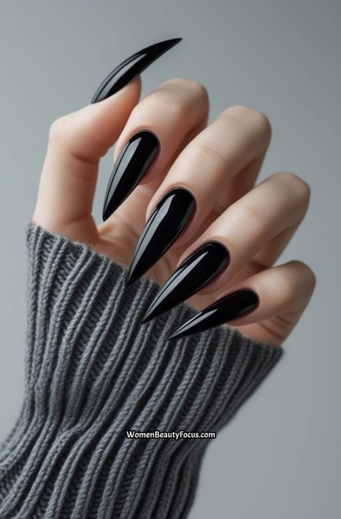 3. Glossy Black Stiletto Nails