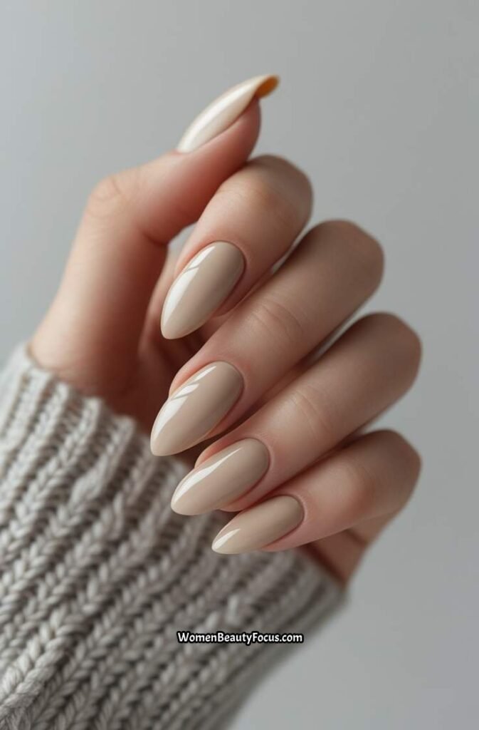 3. Glossy Neutral Almond Nails with Beige Undertones