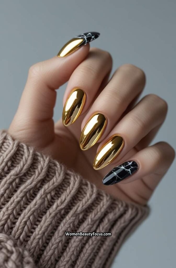 4. Gold Chrome Nails with Black Marble Accents