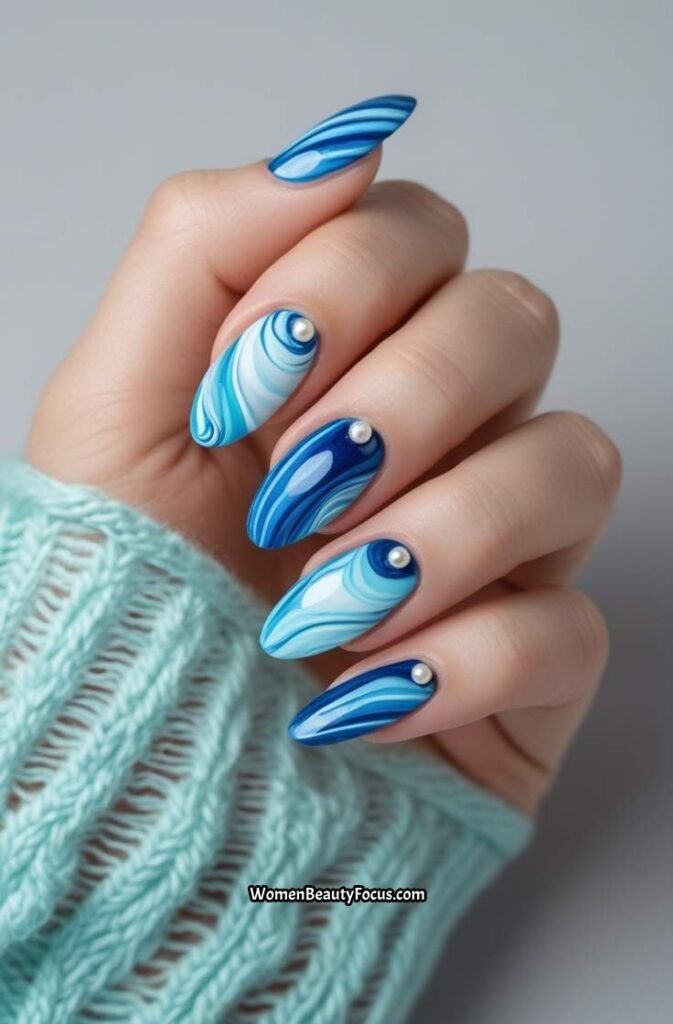4. Ocean Blue Swirl Nails with Pearl Accents