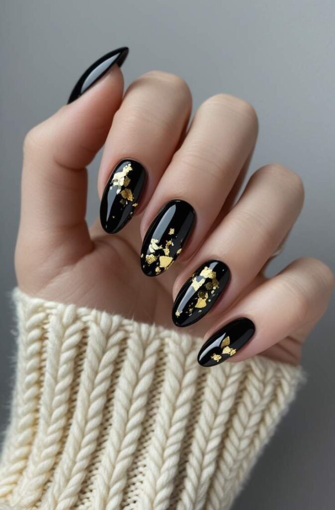 4. Short Black Nails with Gold Flakes