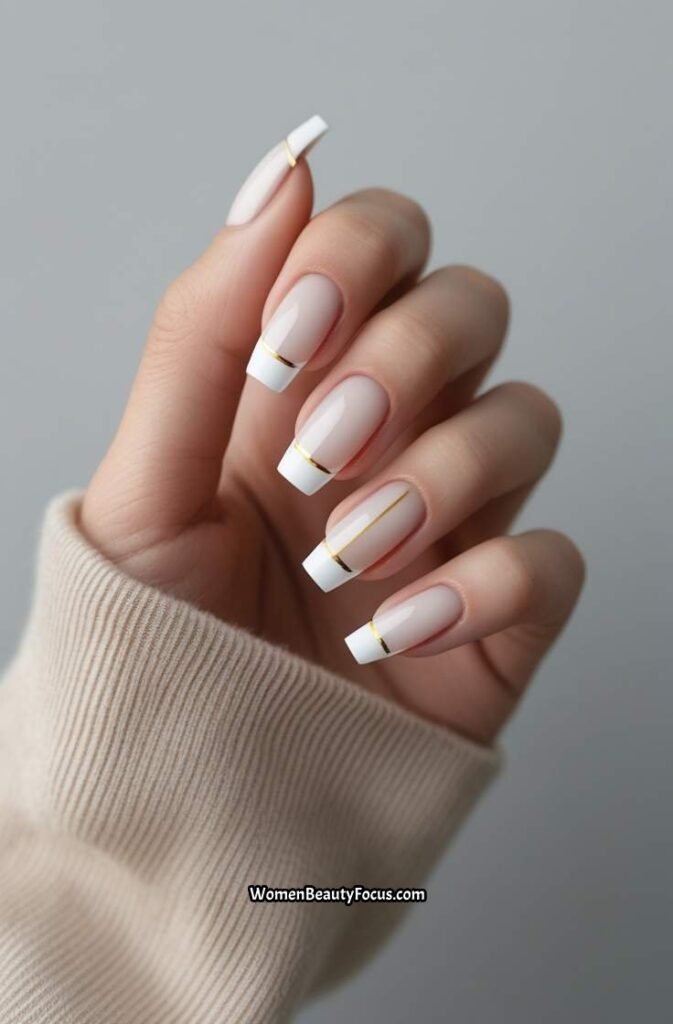 5. Elegant French Tips with Gold Detailing