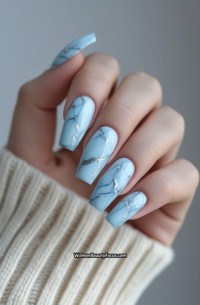 5. Light Blue Marble Nails with Silver Veins