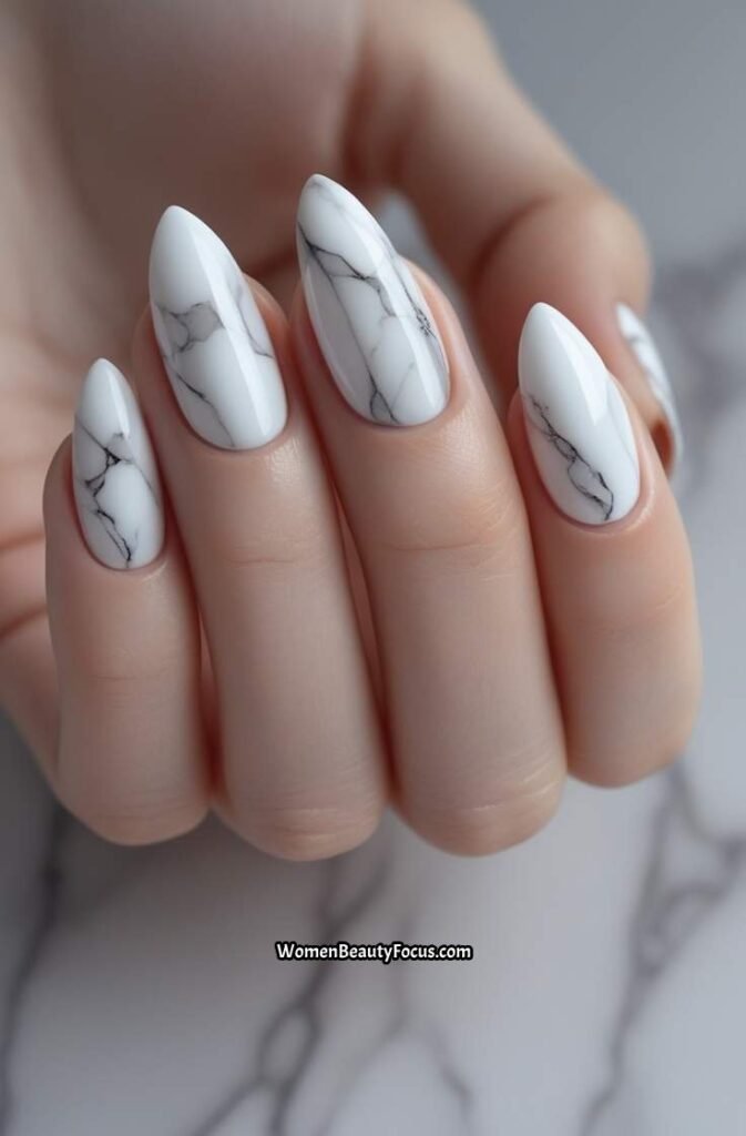 5. Minimalist Almond Nails with White Marble Accents