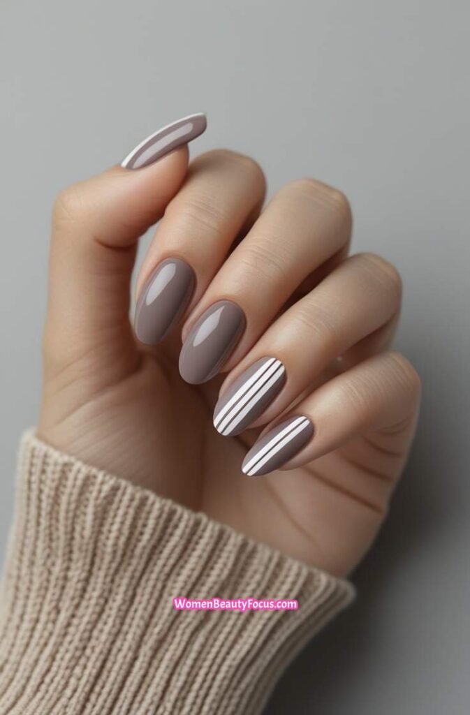 5. Muted Taupe Nails with Subtle Stripes