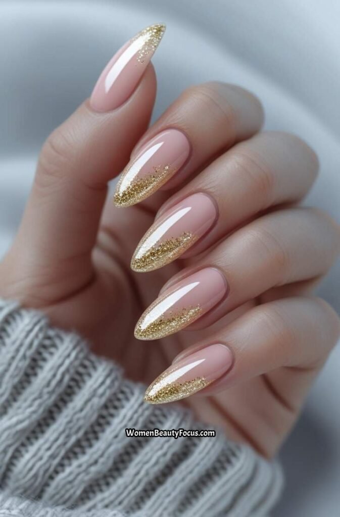 6. Almond Nails with Subtle Gold Glitter