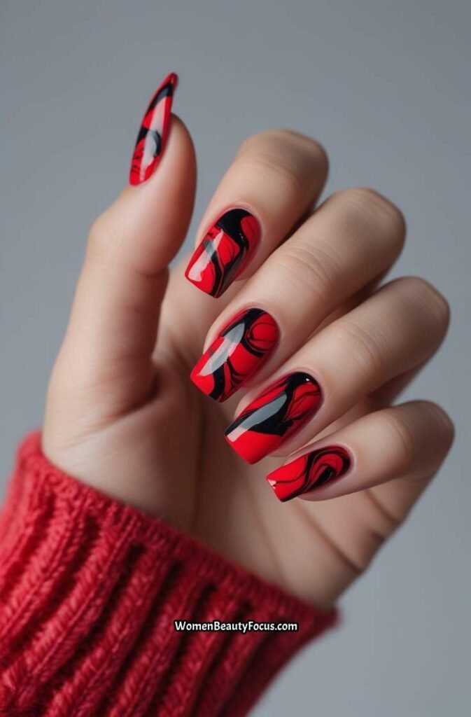 6. Bold Red and Black Marble Nails