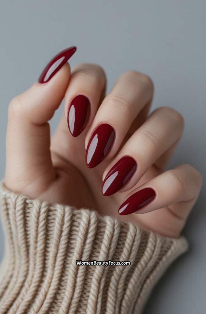 6. Cranberry Red Almond Nails with Glossy Shine