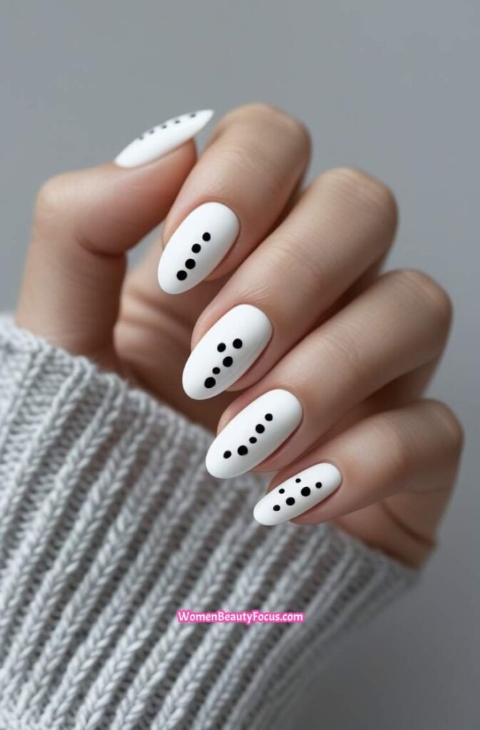 6. Minimalist White Nails with Black Dots