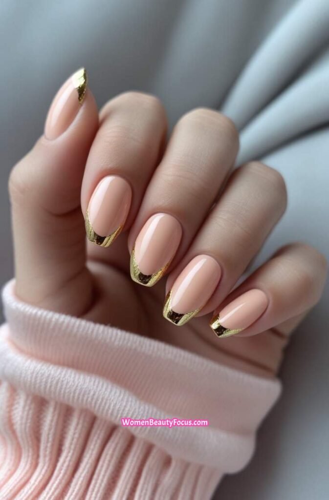 6. Peach Cat Eye Nails with Subtle Gold Touch