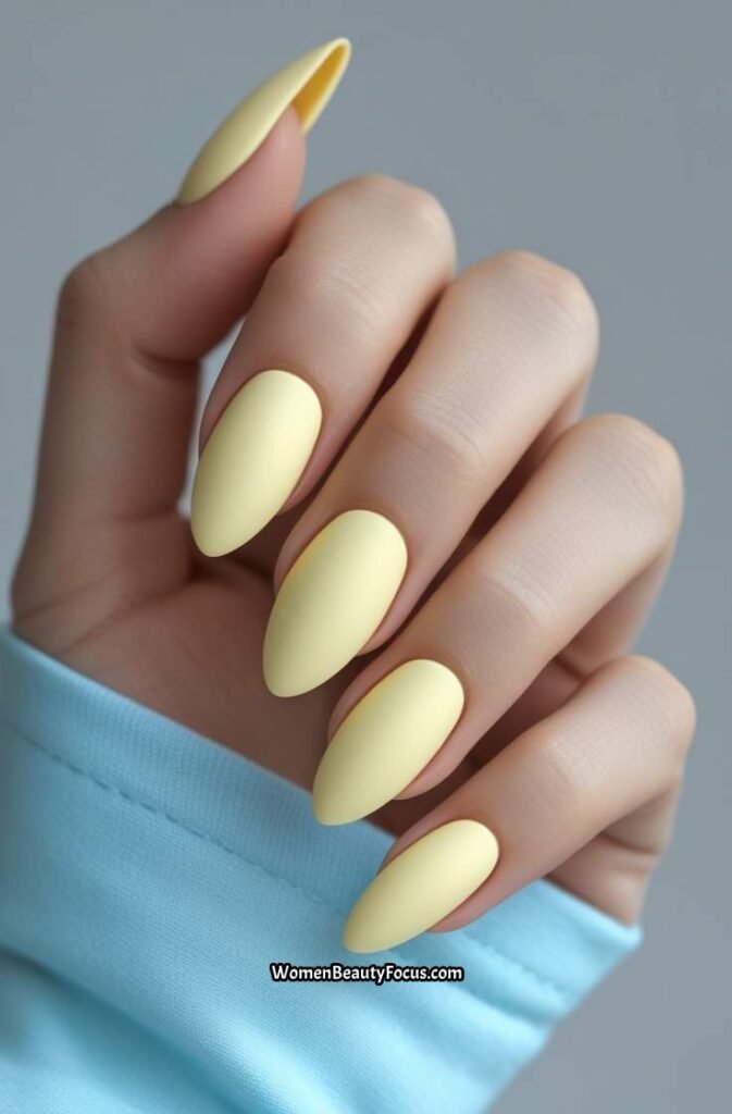 7. Butter Yellow Almond Nails with Matte Finish