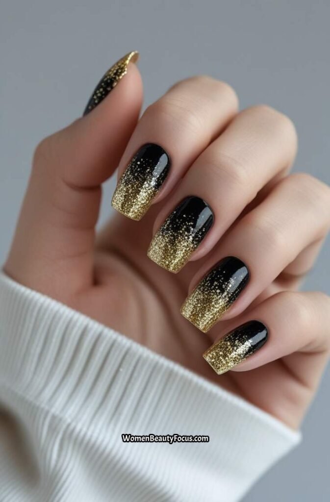 7. Gold Glitter Nails with Black Base