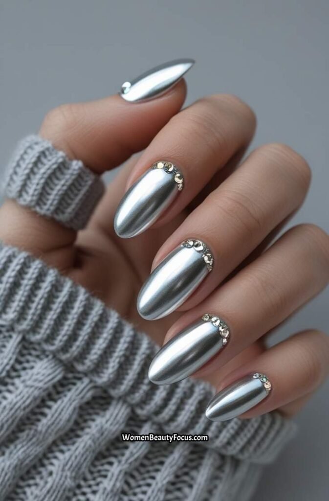 7. Metallic Silver Nails with Crystal Accents