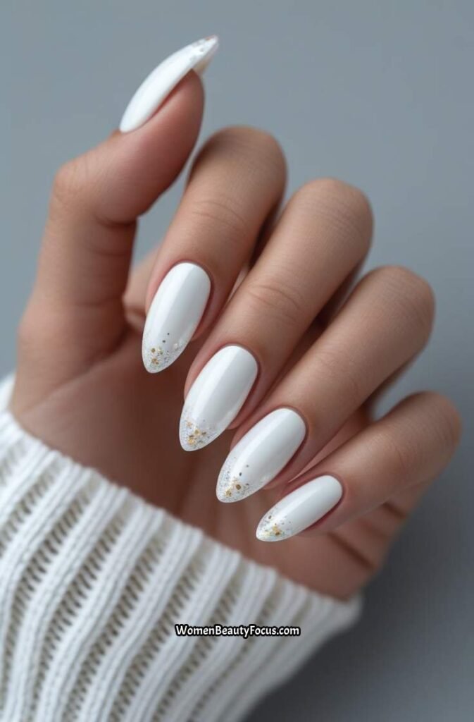 7. Seashell White Nails with Glitter Accents