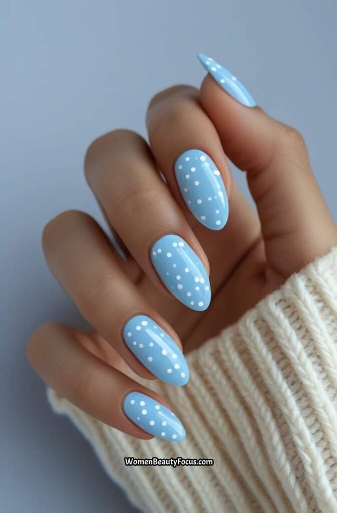 7. Sky Blue Almond Nails with White Dots