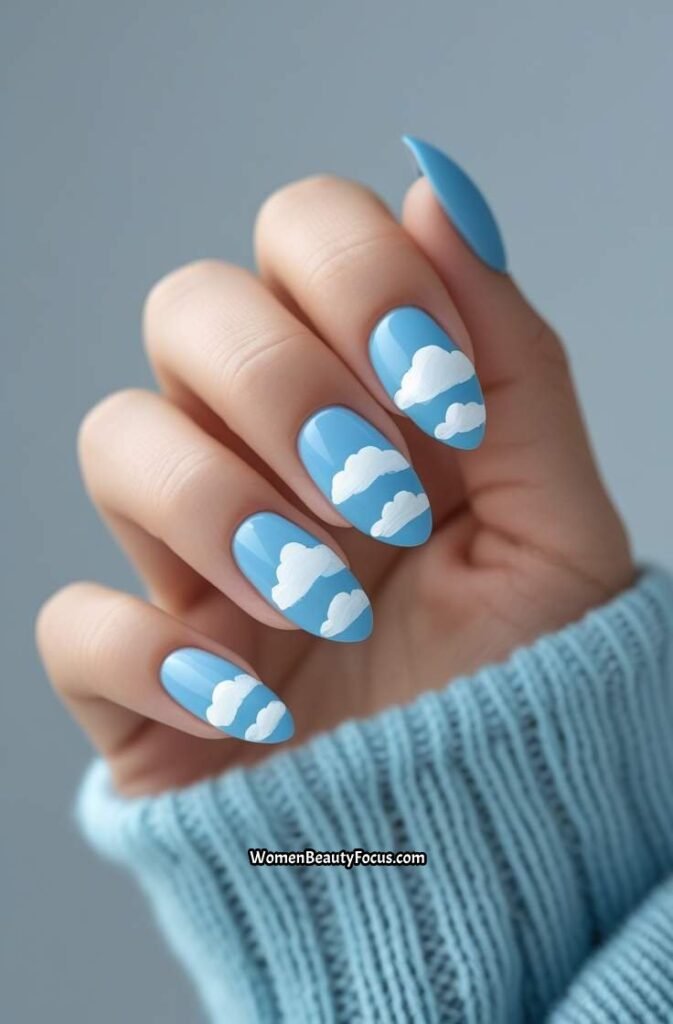 7. Sky Blue Nails with Cloud Art
