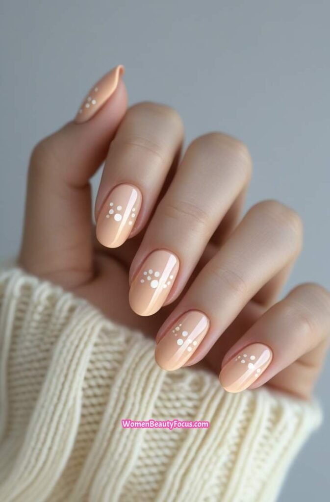 7. Soft Peach Nails with White Dots