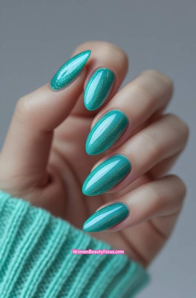 7. Teal Cat Eye Nails with Holographic Effect