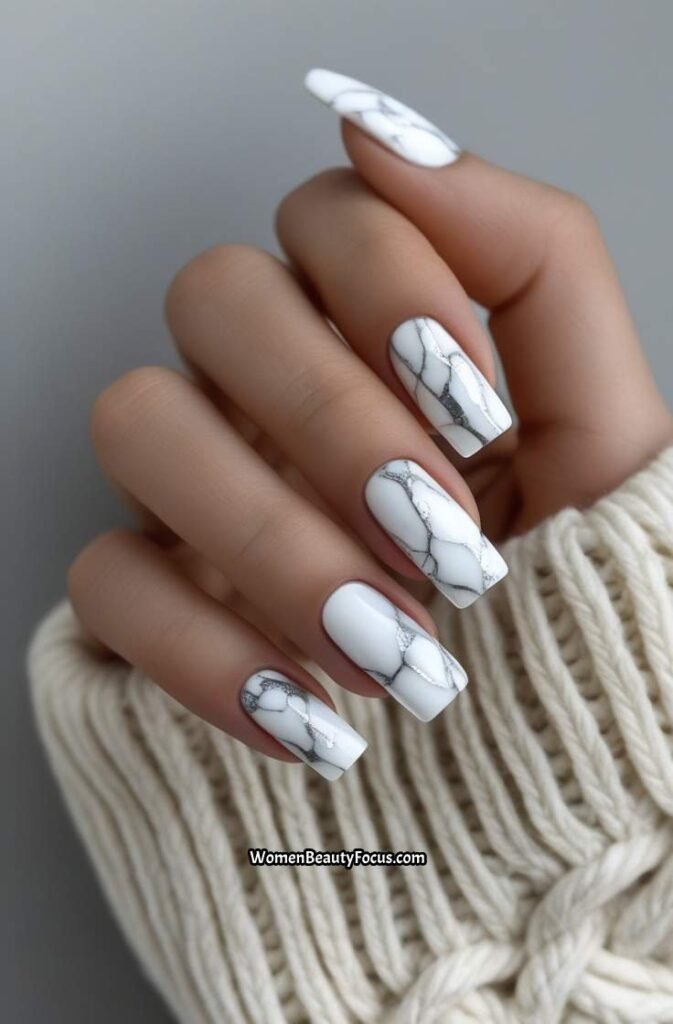 7. White Marble Nails with Silver Veining