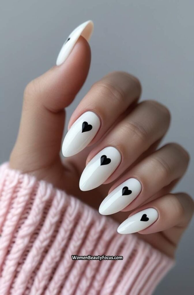 7. White Nails with Minimal Black Hearts