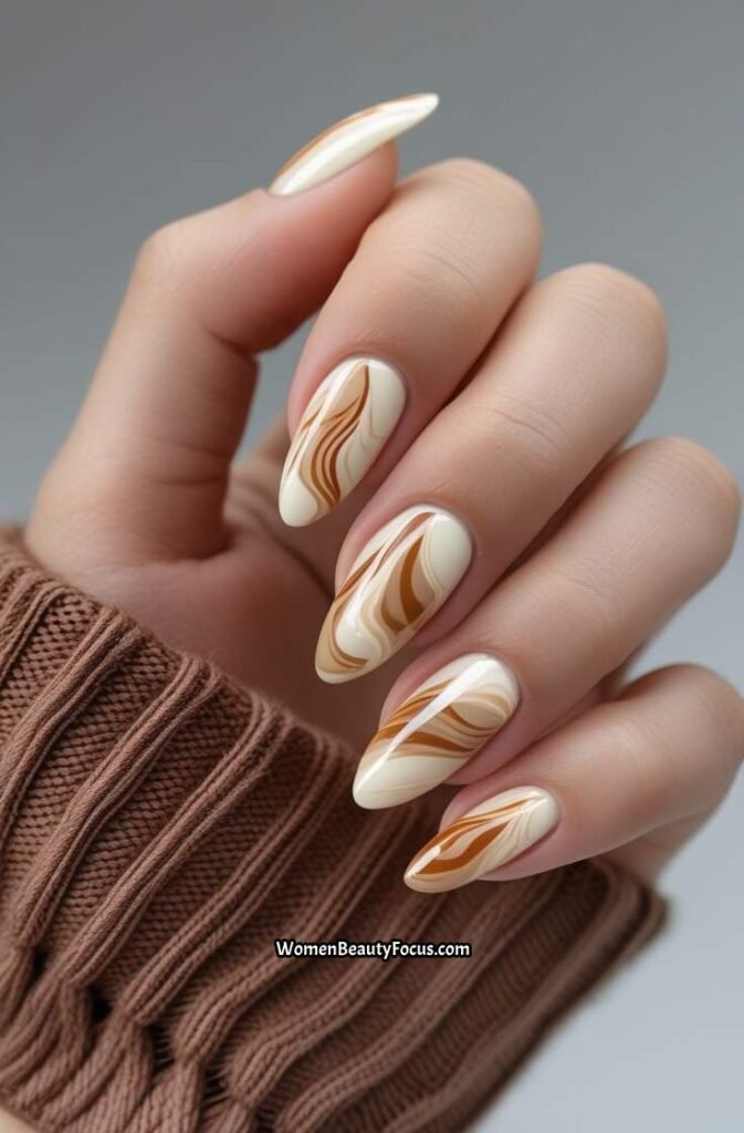 8. Caramel Swirl Nails with Neutral Accents