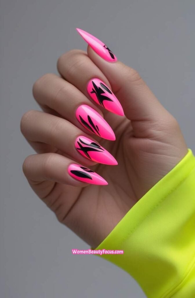 8. Neon Pink Stiletto Nails with Black Designs 8 IMGCentury
