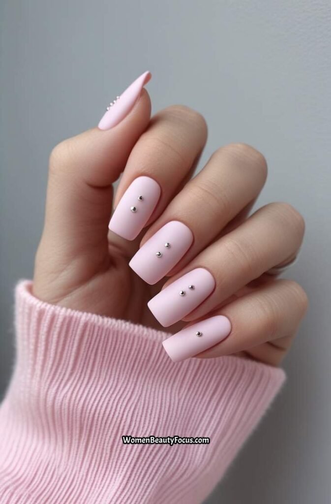 8. Pastel Pink Nails with Tiny Silver Studs