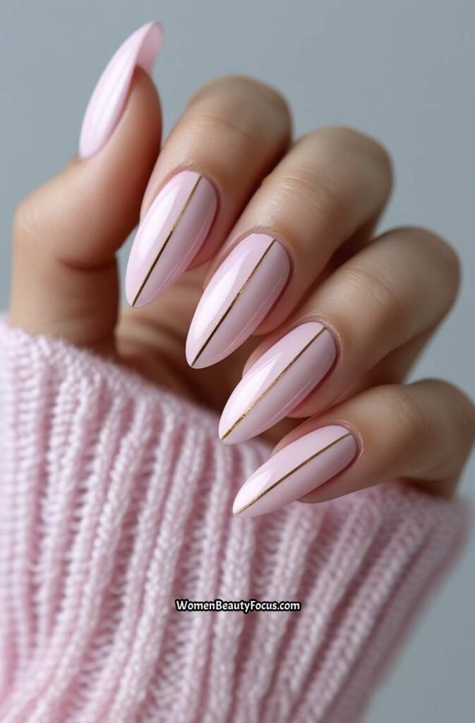 8. Soft Pink Almond Nails with Thin Gold Lines
