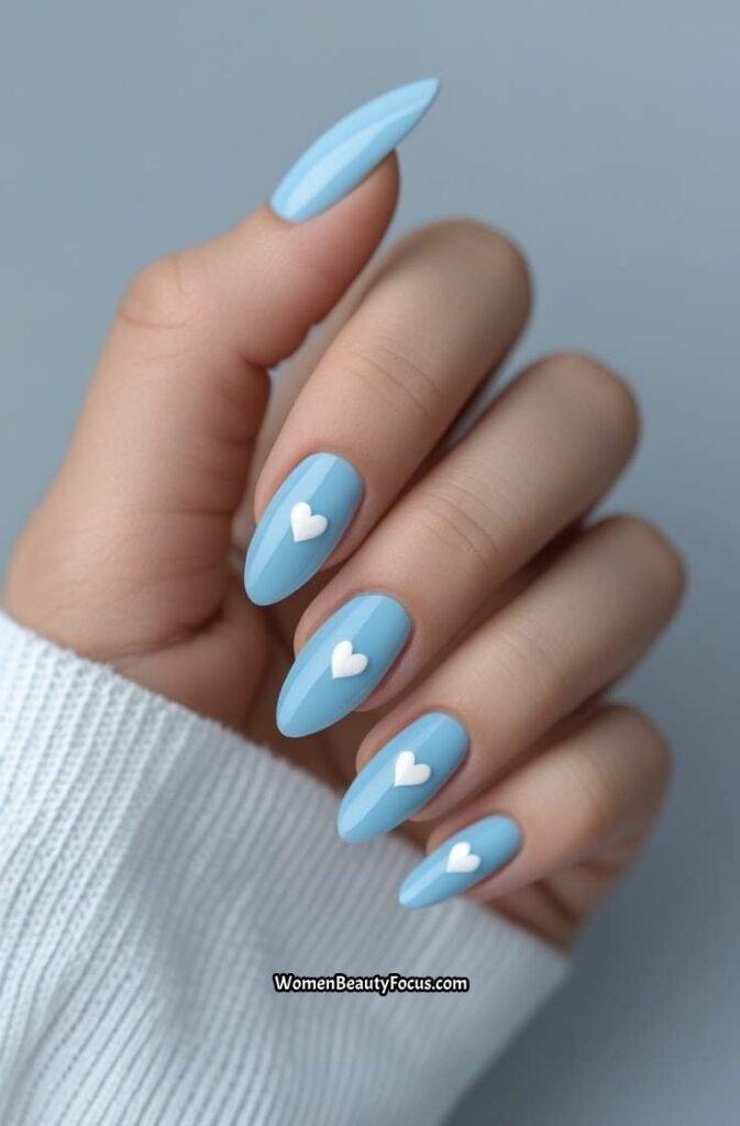 9. Baby Blue Nails with Heart Accents