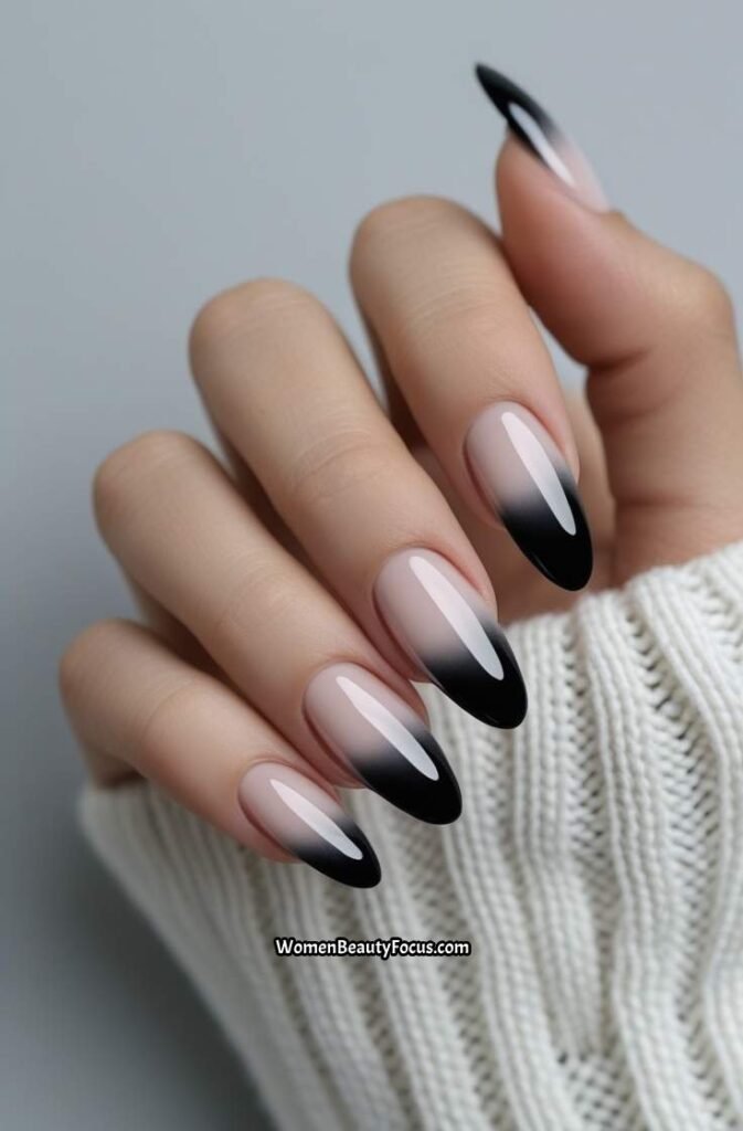 9. Black French Tips with a Glossy Gradient Effect