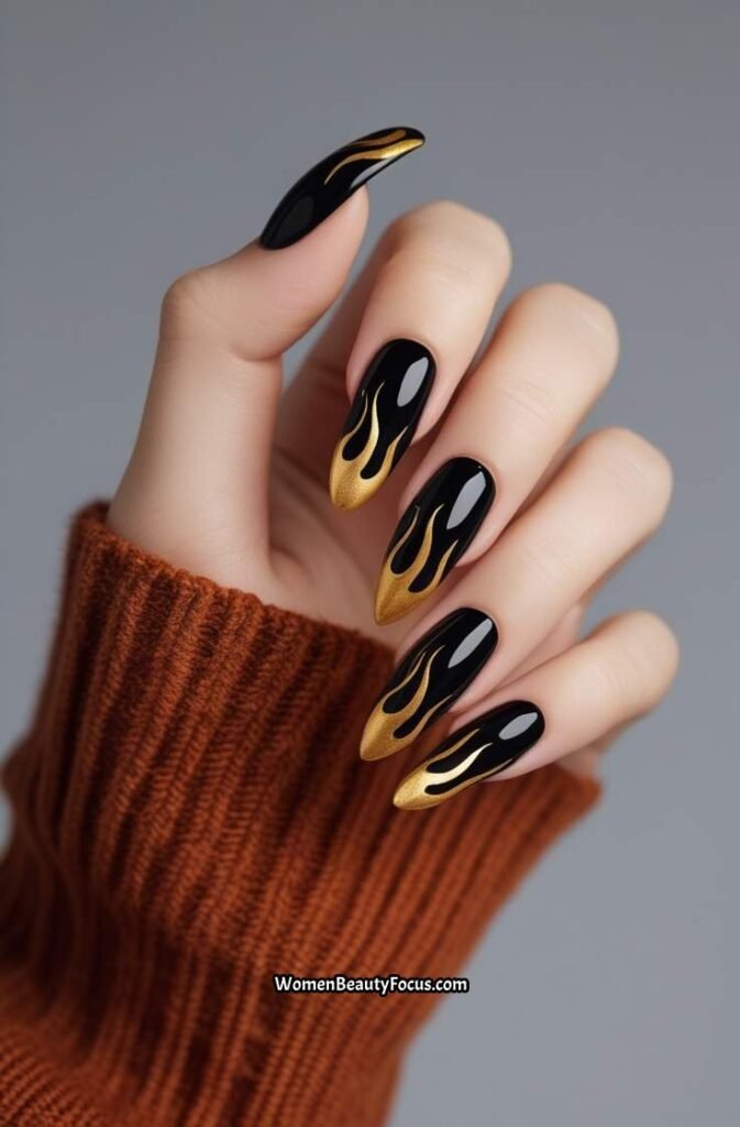 9. Black Nails with Gold Flame Design
