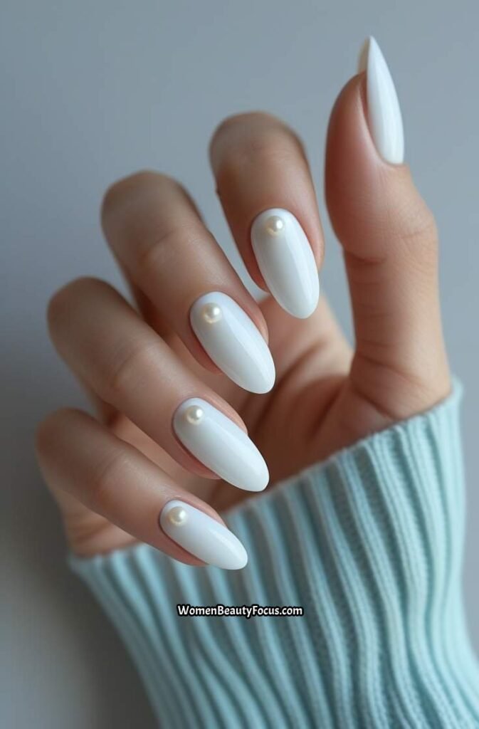 9. Glossy White Nails with Pearl Accents