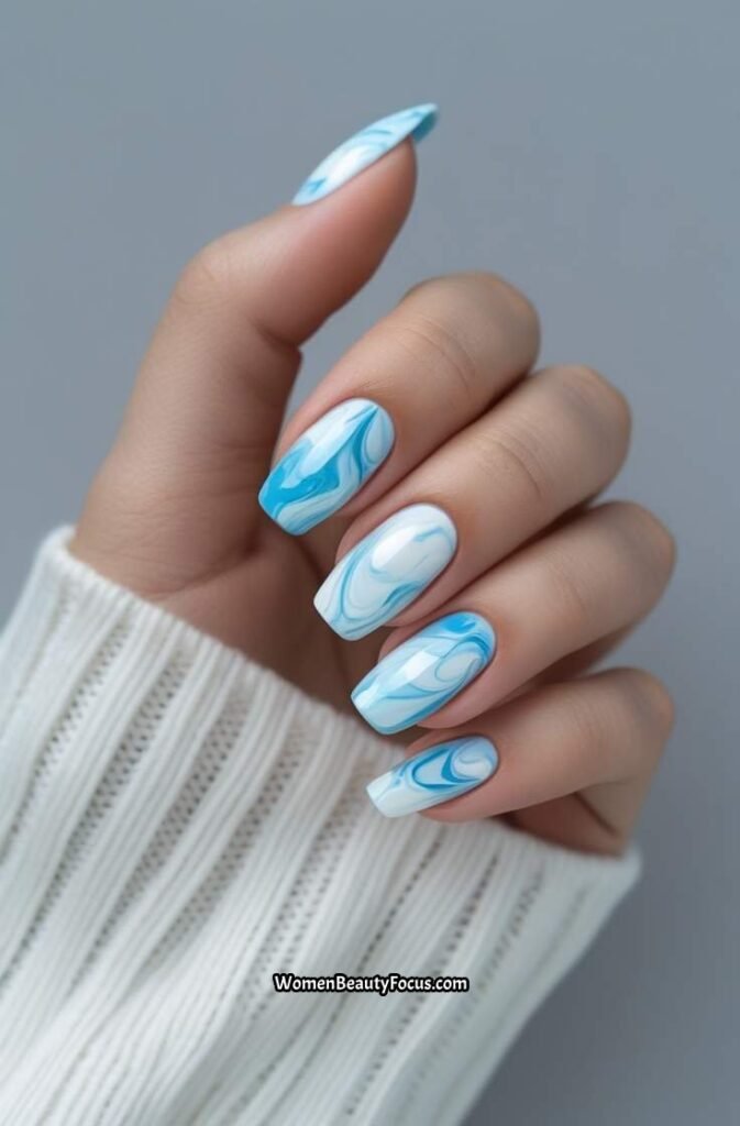 9. Light Blue and White Marbled Nails