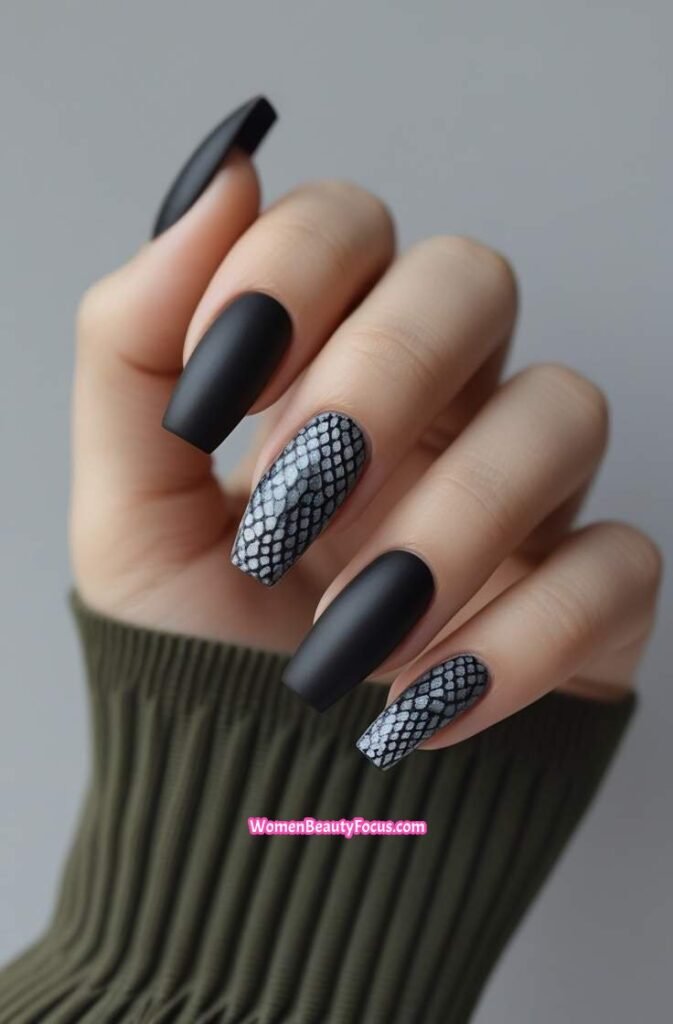 9. Matte Black Nails with Snake Print Accent