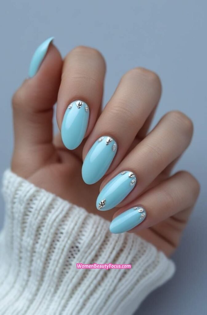 9. Pastel Blue Nails with Silver Detailing